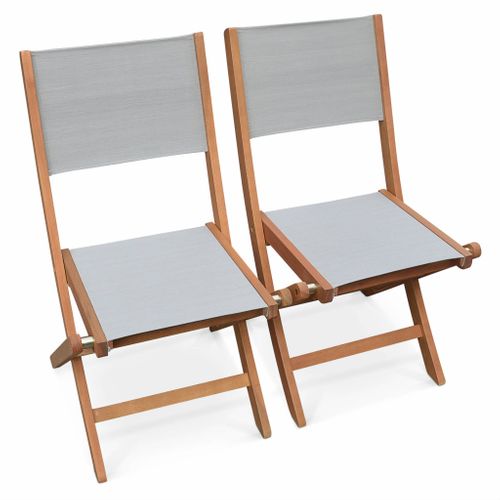 Table De Jardin Extensible Bois D'eucalyptus + 8 Assises En Bois D'eucalyptus Huilé Et Textilène